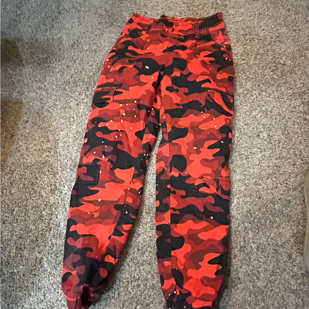 Red Camo pants with white paint splotches.